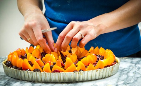 Apricot, cherry, Pistachio Tart placing fruit